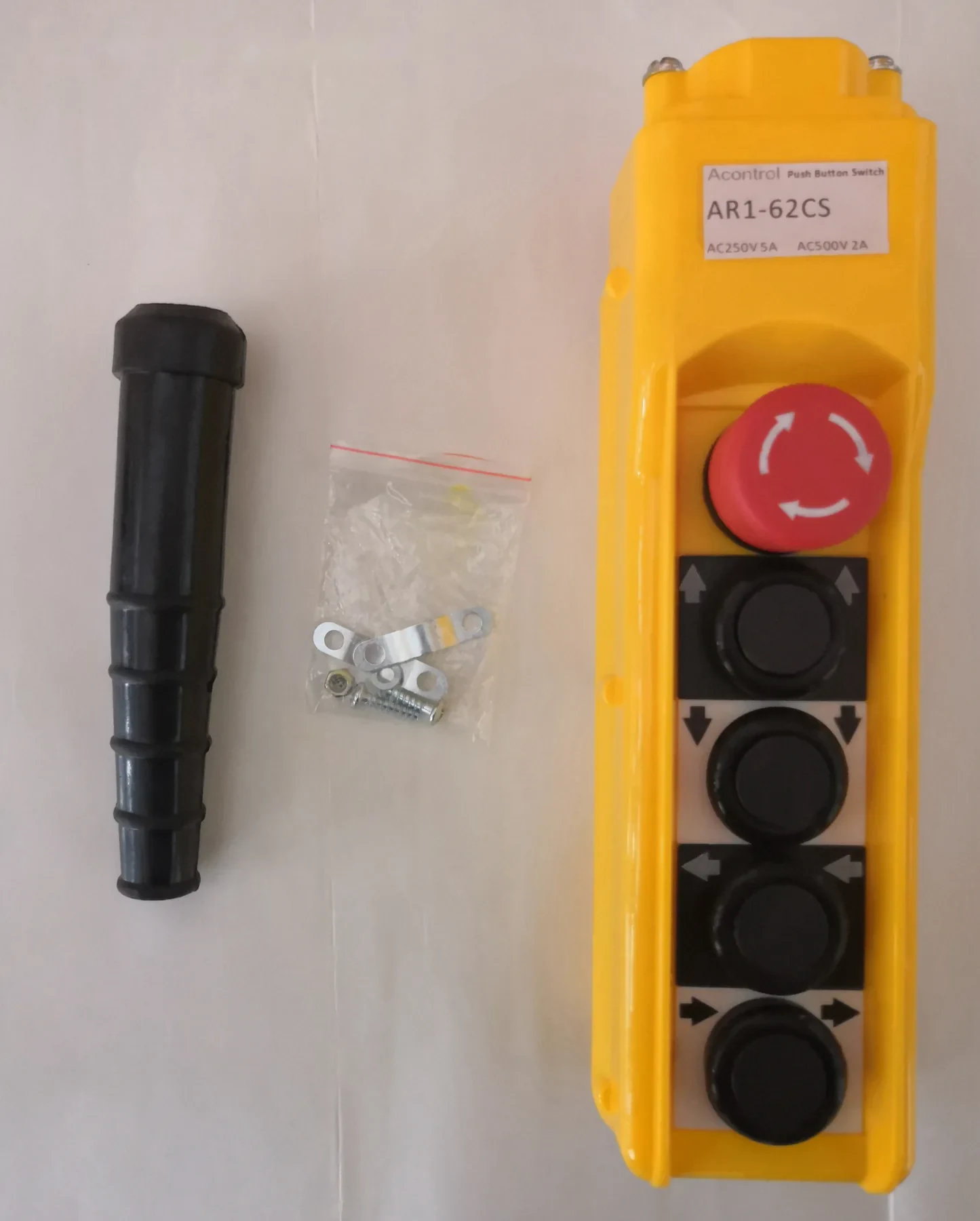 Yellow industrial pendant control station with red emergency stop button