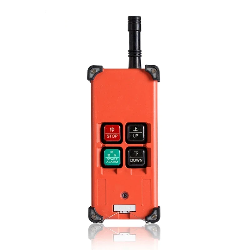 Orange industrial wireless remote control with antenna, stop, up, down and alarm buttons on white background