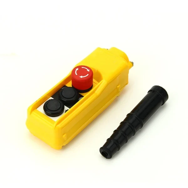 Yellow industrial pendant control station with red emergency stop button, two black buttons, and black cable boot