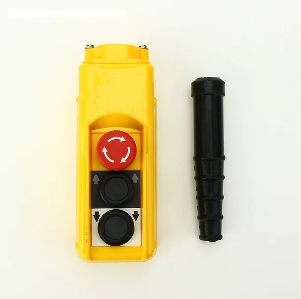 Yellow pendant control station with red emergency stop, two black