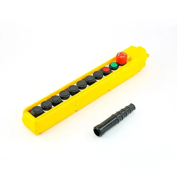 Yellow pendant pushbutton control station with black buttons plus red and green buttons, with a black cable boot on white