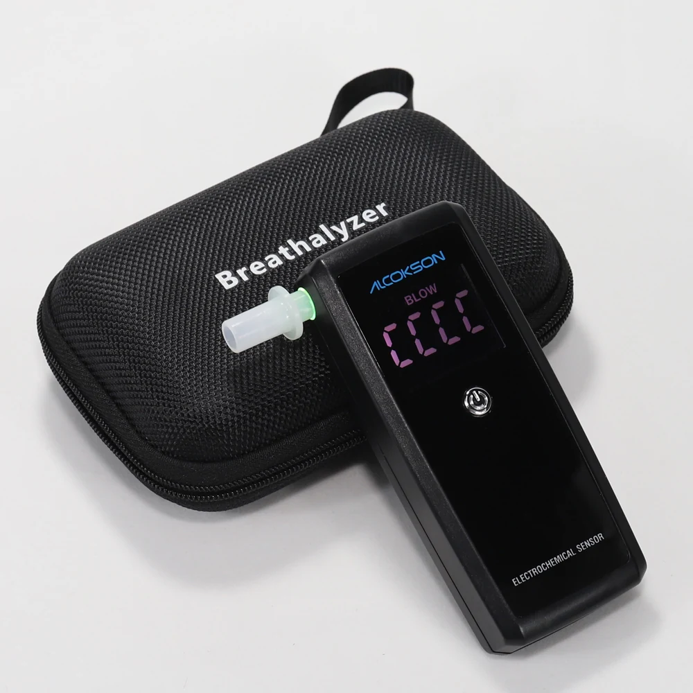 ALC-215 breath alcohol tester with the display lit and the mouthpiece fitted