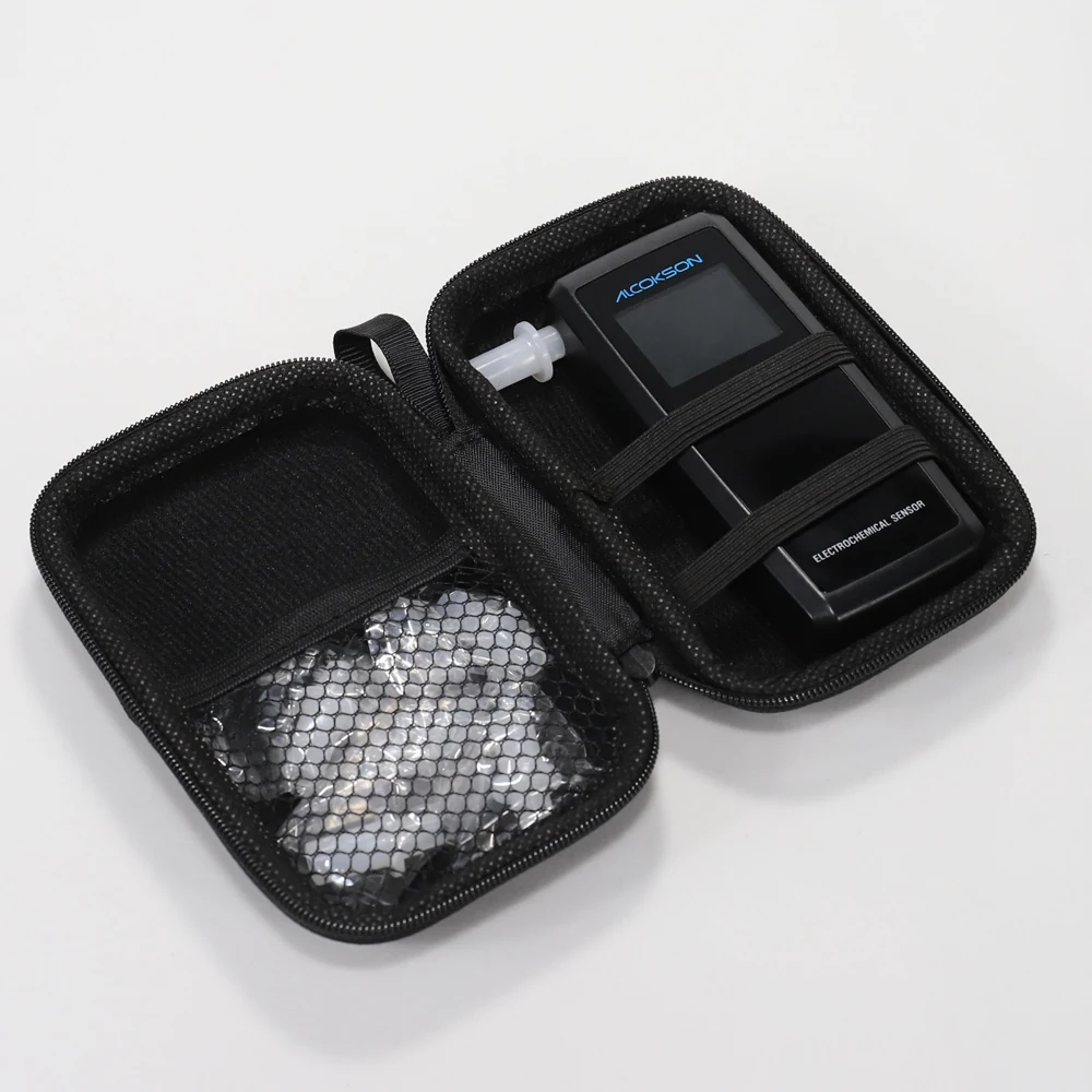 ALC-213 breath alcohol tester in the open zipped carry case with spare mouthpieces