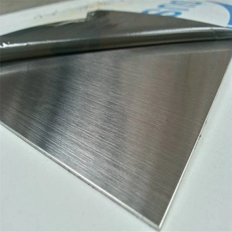 Hairline finish stainless steel sheets stacked with protective film