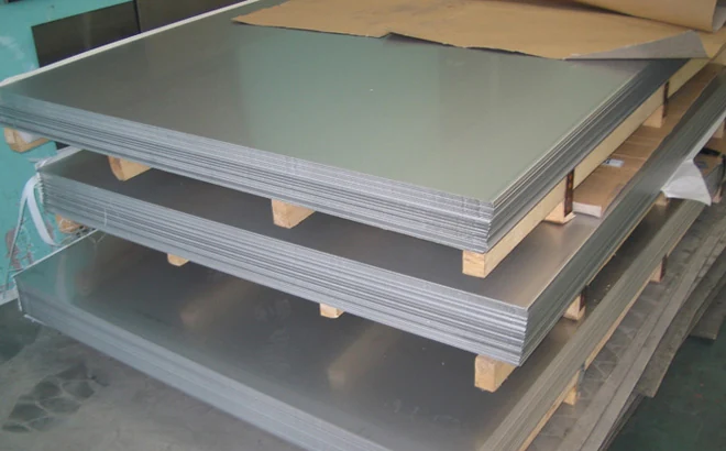 Stainless steel plate stacked on timber skids and strapped for export