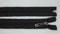 Black metal zippers laid flat on a white background, one with a metal slider pull visible