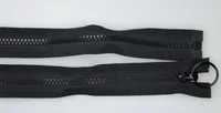 Two black zippers with coil teeth on white background, one with slider