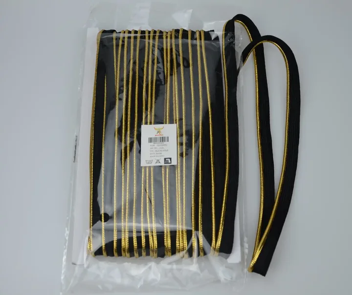 Black and gold cord trim packaged in a clear plastic bag.