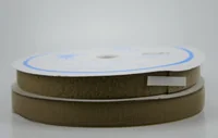 Two rolls of tan hook-and-loop fastener tape stacked on a white background
