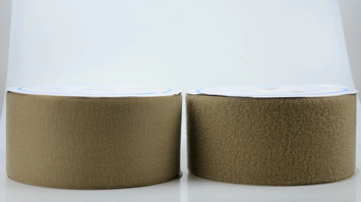 Two tan hook-and-loop fastener tape rolls side by side on a white background