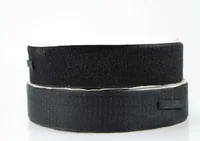 Two rolls of black hook-and-loop fastener tape stacked on a white background