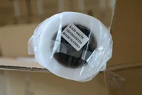 Roll of white hook and loop tape in plastic wrap, label reads S-030 White 100CMX25YDS Made in China