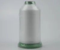 Large cone of white industrial thread wrapped in protective mesh, with green plastic ends, on a plain light background
