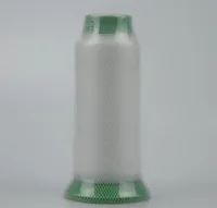 Large spool of white thread wrapped in green mesh netting on a plain gray background