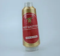 A gold thread cone with a red MUSATEX label on a white background.