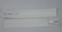 Two white nylon coil zippers with slider pulls laid open on a plain light background