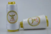 Two white polyester sewing thread cones with yellow ends, labelled MUSATEX, on a plain background