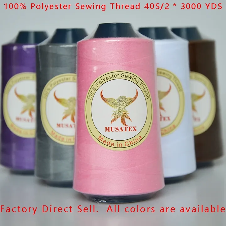 Five cones of MUSATEX polyester sewing thread in various colors.