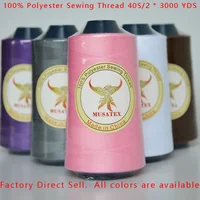 Five cones of MUSATEX polyester sewing thread in various colors.