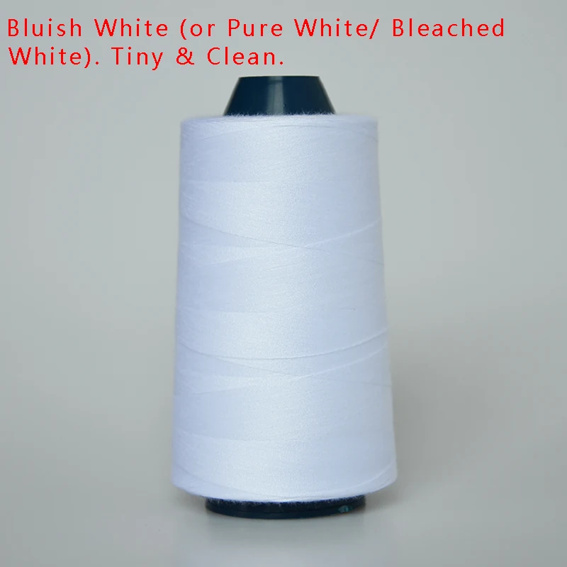 White sewing thread wound on a