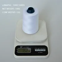 White thread cone on a digital scale with length and weight specs overlaid.