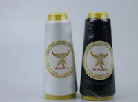 White and black polyester sewing thread cones with MUSATEX phoenix labels on a plain light background