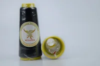 Two black polyester sewing thread cones with yellow ends, one showing a MUSATEX phoenix label, on a plain light background.
