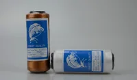 Two spools of metallic sewing thread, one copper and one silver, with blue and white labels.