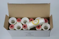 Open carton of MUSATEX branded spools of white thread.