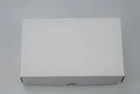 Plain white cardboard box with a finger cutout on the front edge, photographed on a white background