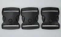 Three black plastic side-release buckles arranged in a row on a plain light gray background