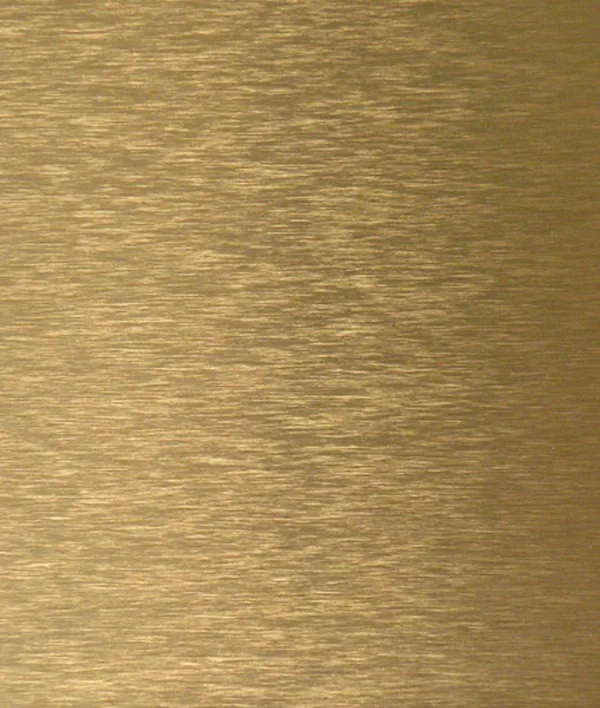 Brushed aluminum composite panel with directional grain in champagne gold