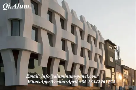 A woven facade curtain wall composed of solid aluminum panels spliced together