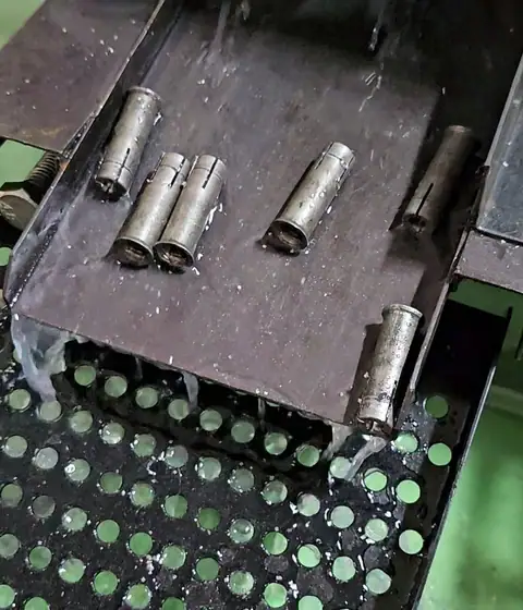 Lip edge drop in anchor cross indexing slotting machine