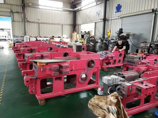 Painted machine frames moving through the assembly line at the Anchors Machinery works in Ningbo China
