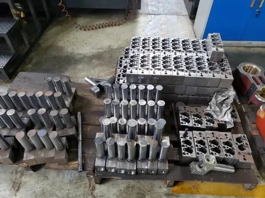 Machined clamp and slider components staged in sets at the Anchors Machinery works in Ningbo China