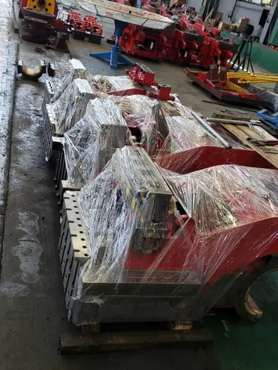 Wrapped frames and castings on the staging floor at the Anchors Machinery works in Ningbo China