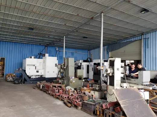 Machined parts and castings staged in the covered material area at the Anchors Machinery works in Ningbo China