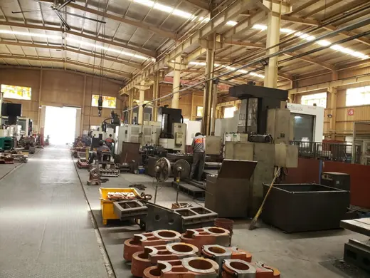 Machined rings and parts staged beside the machine tools at the Anchors Machinery works in Ningbo China