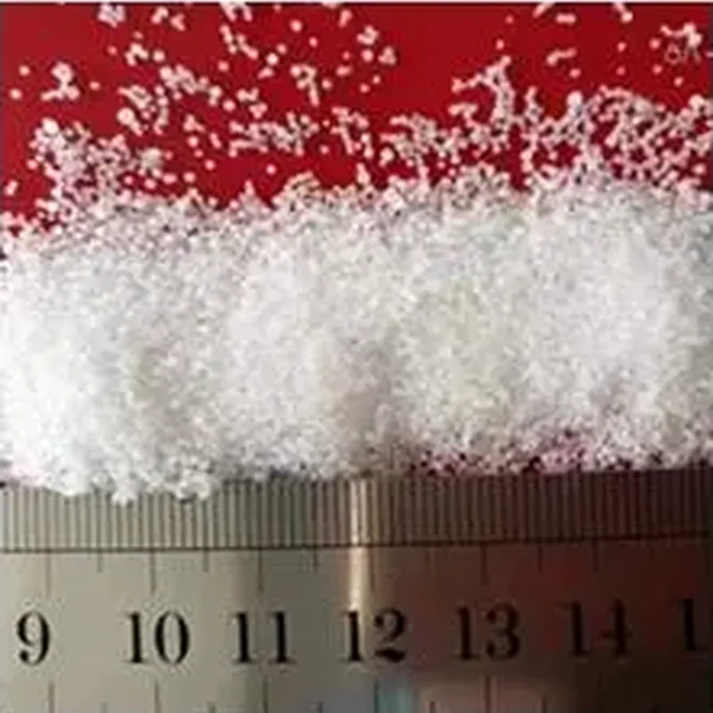 Pearl diameter checked against a rule during production