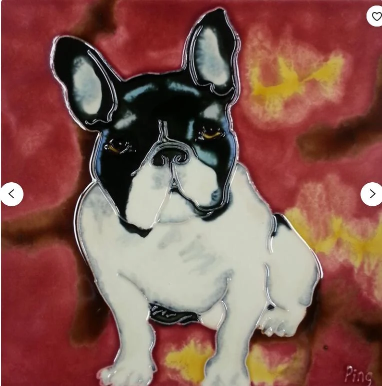 Hand painted ceramic tile in deep red glaze