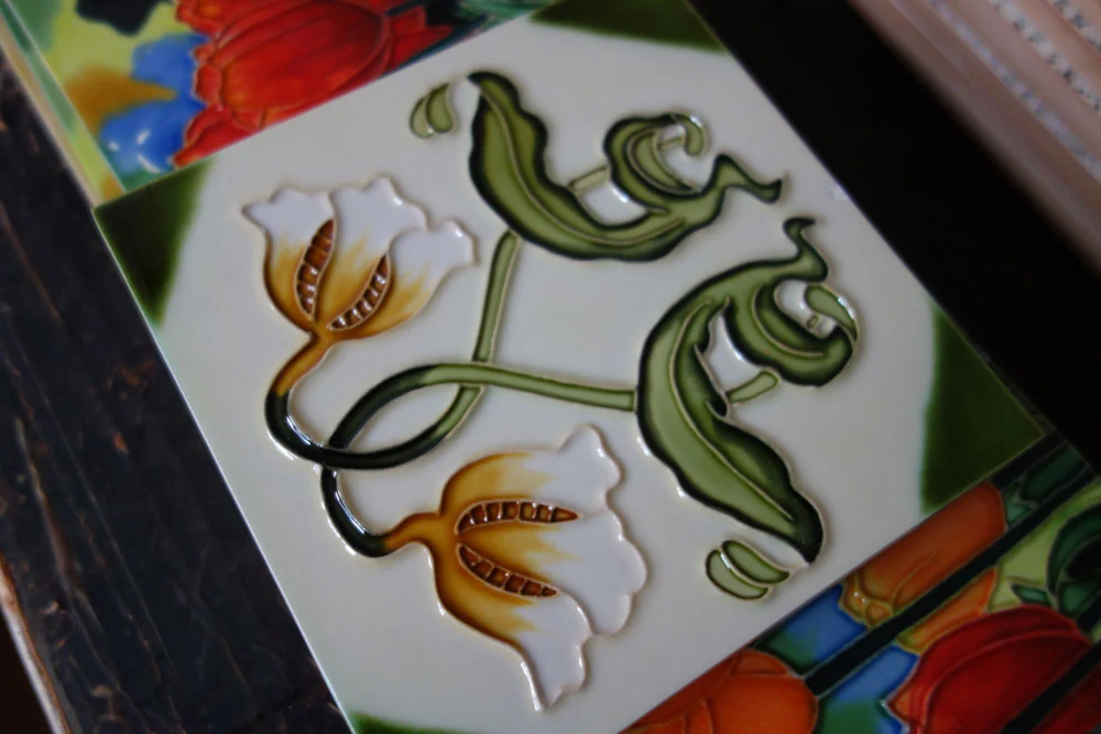 Hand painted ceramic coaster tile in deep red glaze