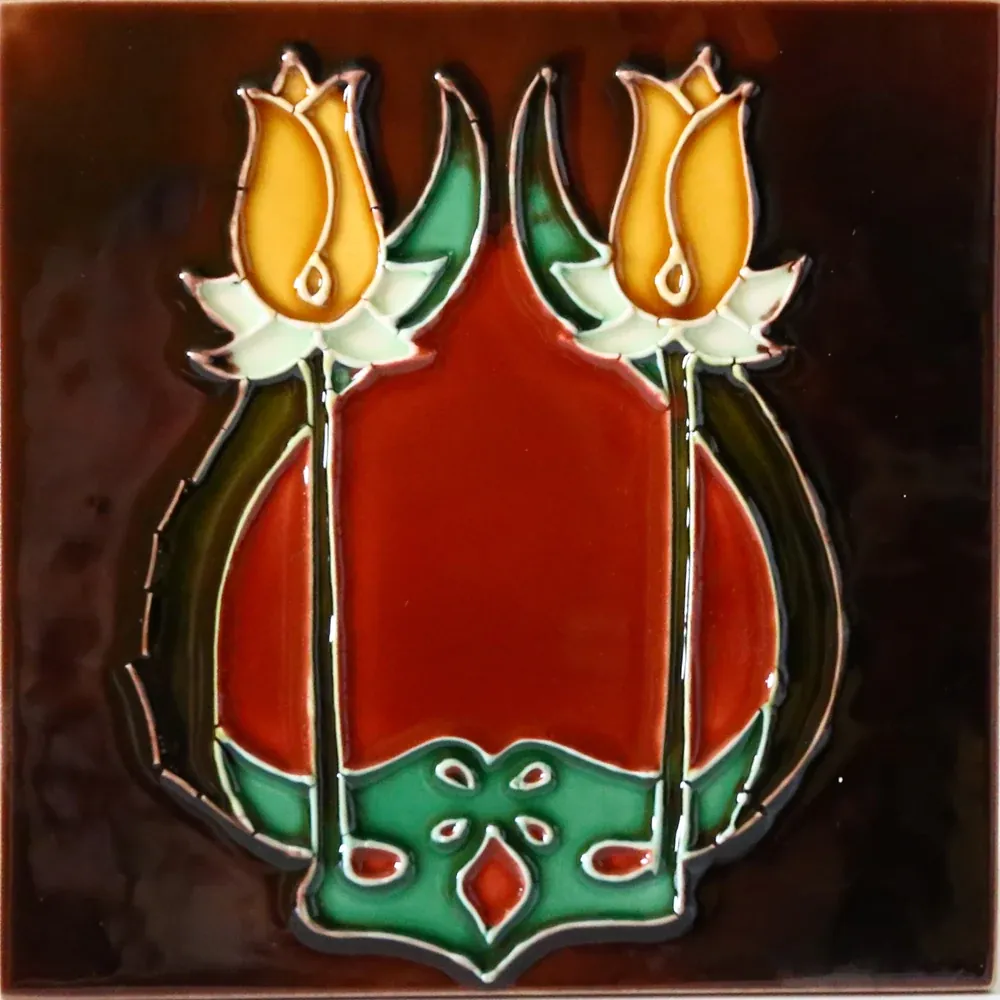Hand painted fireplace tile with relief outline and bright glaze