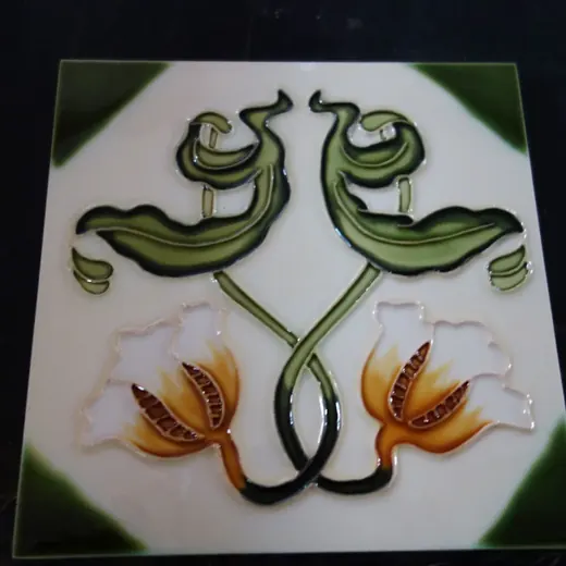 Handmade decorative ceramic tile with relief floral motif