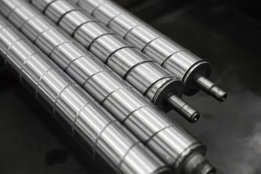 Intermediate roll for tension leveler applications