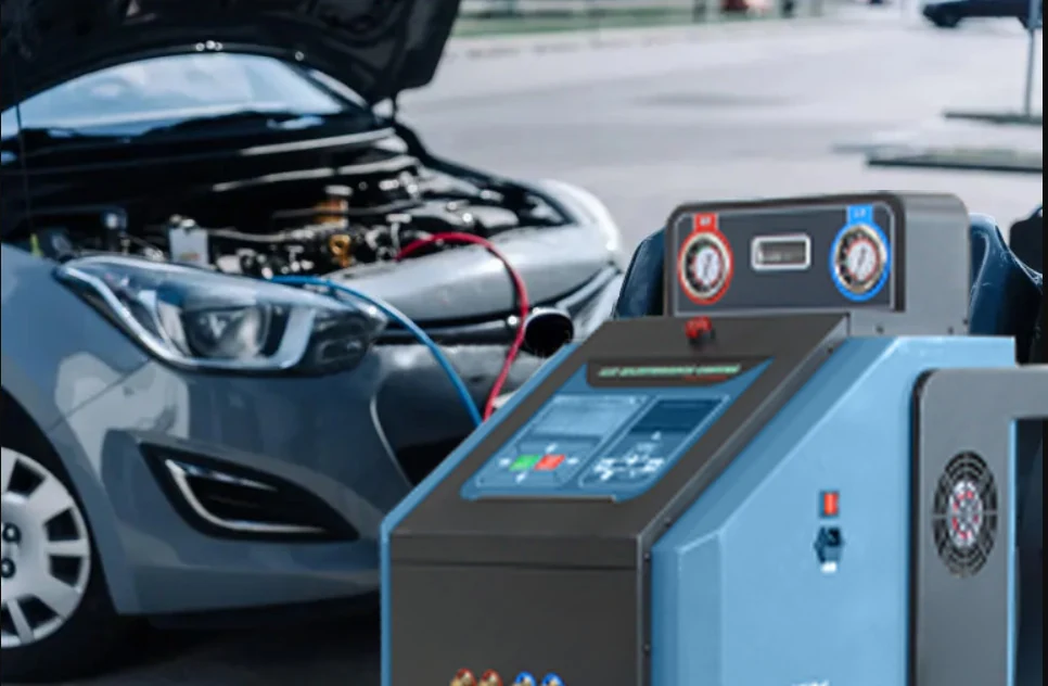 AC service machine connected to a car with the bonnet open