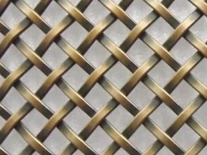 Brass toned woven decorative mesh close up