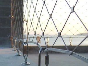 Stainless cable mesh barrier along a walkway