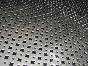 Perforated metal sheet in a decorative cross pattern