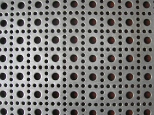 Perforated metal sheet with round holes on a staggered pitch